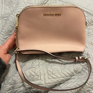Michael Kors Crossbody Powder Blush. There is light dye stain on one side